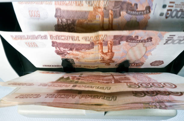 istock electronic money counter machine is counting the Russian five-thousandth ruble banknotes 880508434