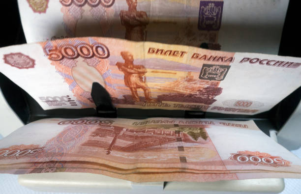 istock electronic money counter machine is counting the Russian five-thousandth ruble banknotes 880508450