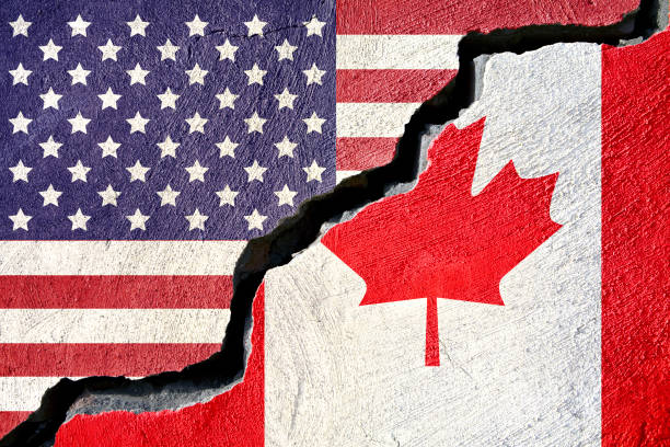 istock Concept american and Canada flag on cracked background 880541138