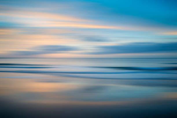 Beautiful long exposure blur sunrise landsdcape of idyllic Broadhaven Bay beach on Pembrokeshire Coast in Wales Stunning long exposure blur sunrise landsdcape of idyllic Broadhaven Bay beach on Pembrokeshire Coast in Wales sunrise timelapse stock pictures, royalty-free photos & images