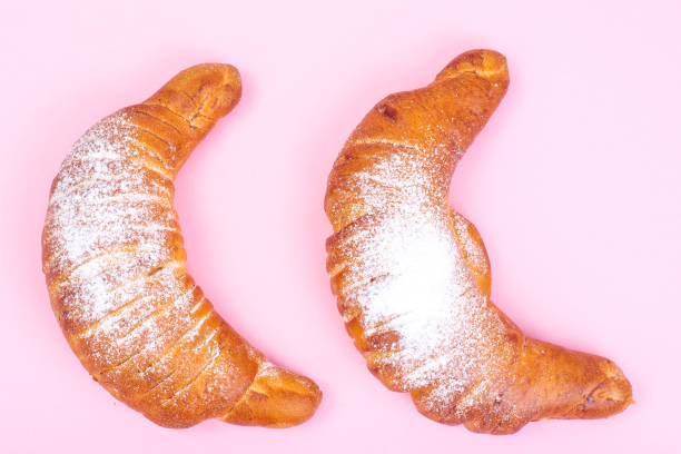 istock Fresh croissants sprinkled with powdered sugar 880556816