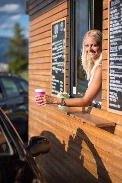 istock Drive-in caffe female clerk 880565240