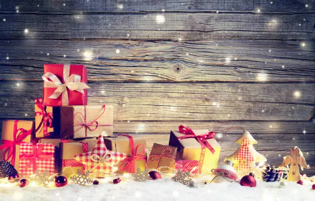 Rustic package On Snow With Christmas Lights, baubles