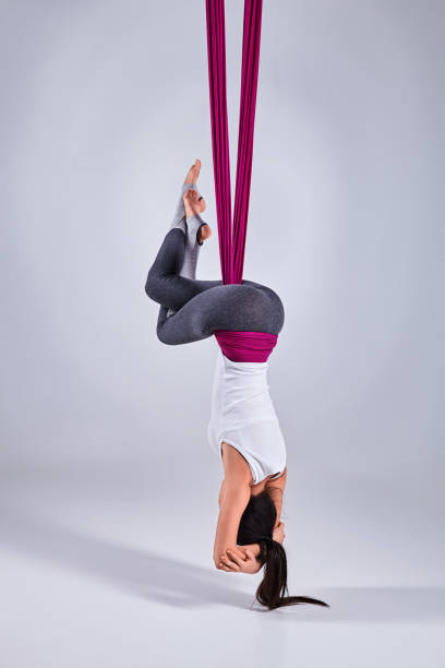 istock Aerial different inversion antigravity yoga in a hammock 880586216