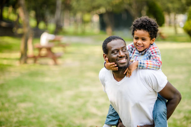 istock Father and son at the park. 880589568