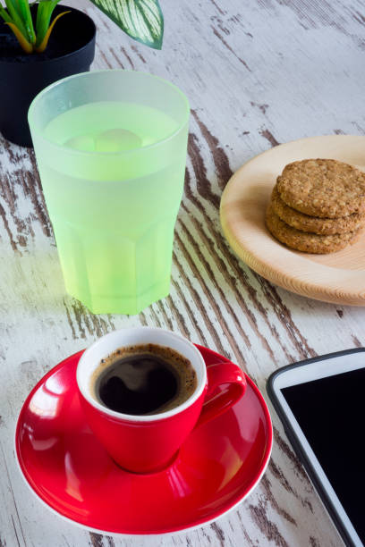 istock Espresso coffee in a white coffee cup and bag with coffee beans in a bag 880596278