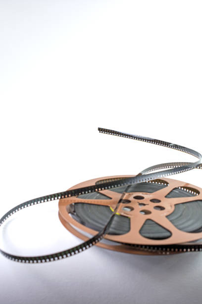 istock Old 8mm film on reel with shadows 880598742