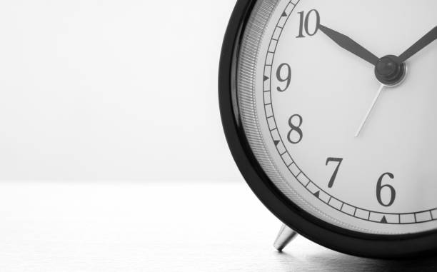 istock Closeup of Retro alarm clock with twelve o'clock. Time is indefinite continued progress of existence, events that occur in apparently irreversible succession from past through present in to the future 880615560