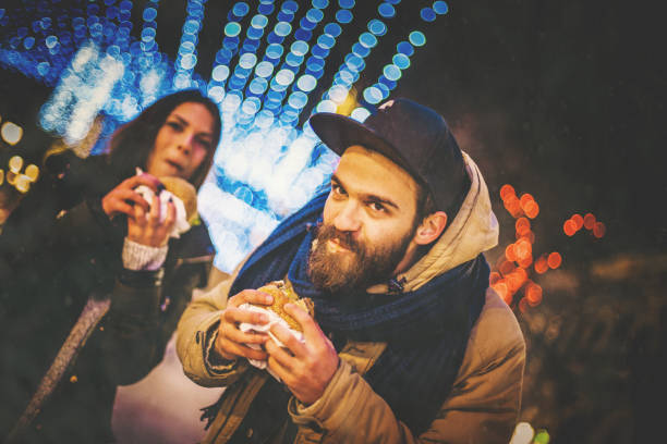 istock Two people eating sandwiches outside 880619824