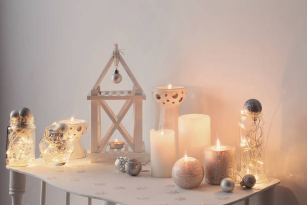 istock Christmas decoration with candles on background  white wall 880619992