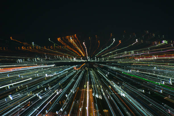 istock light lines with long exposure,  speed motion abstract background in the dark night ,  blast zoom effect , zoom burst of light in the city 880638284