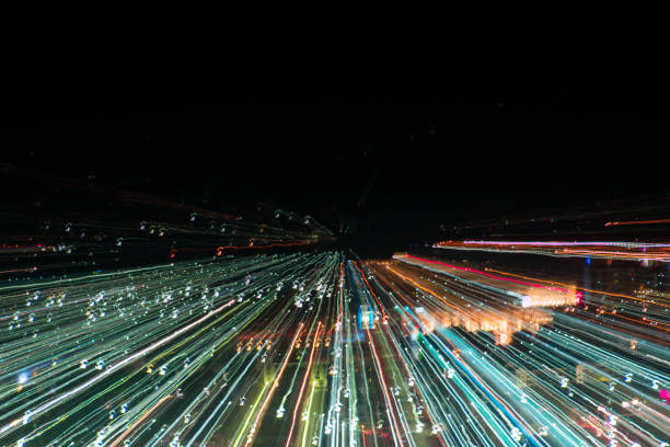 istock light lines with long exposure,  speed motion abstract background in the dark night ,  blast zoom effect , zoom burst of light in the city 880638296
