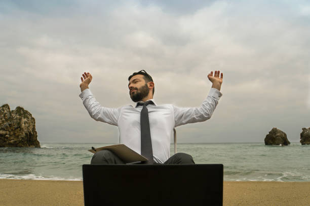 istock Business Man Writing Note in the Seaside While Sitting Down 880638610