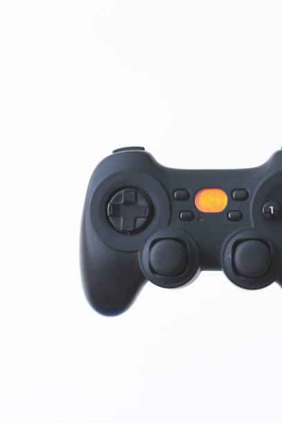 istock Close-up of a black gamepad on a white background. 880640878