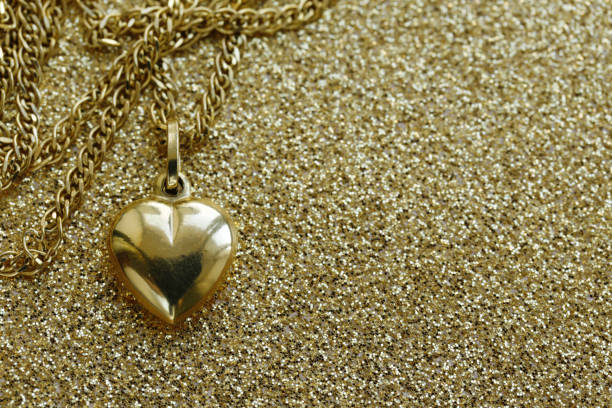 istock pendant gold heart - a gift for the holiday 880696012