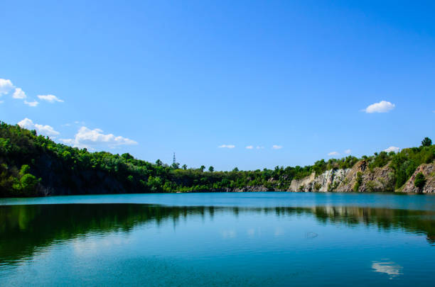 istock Beautiful lake in abandoned granite quarry 880742884