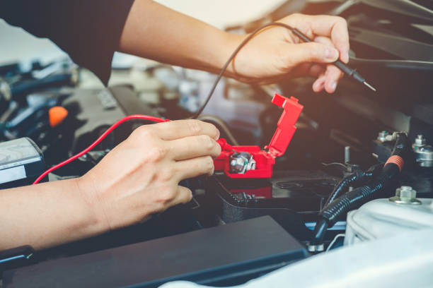 istock Hands check battery car mechanic working in auto repair service 880745180