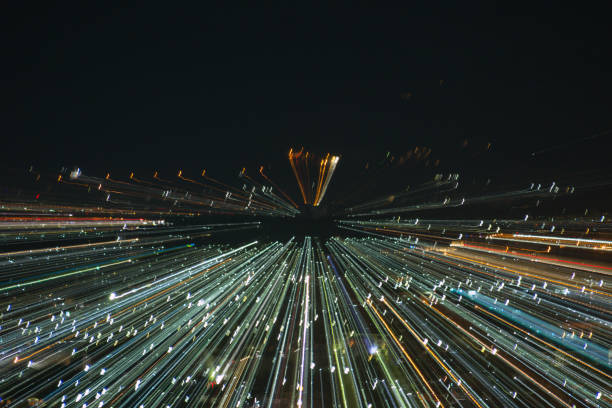 istock light lines with long exposure,  speed motion abstract background in the dark night ,  blast zoom effect , zoom burst of light in the city 880748294