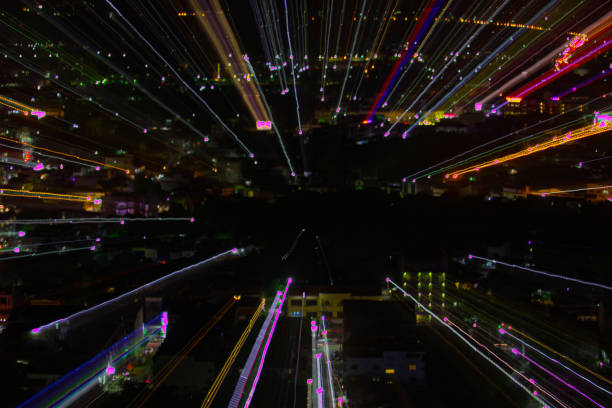 istock light lines with long exposure,  speed motion abstract background in the dark night ,  blast zoom effect , zoom burst of light in the city 880748358