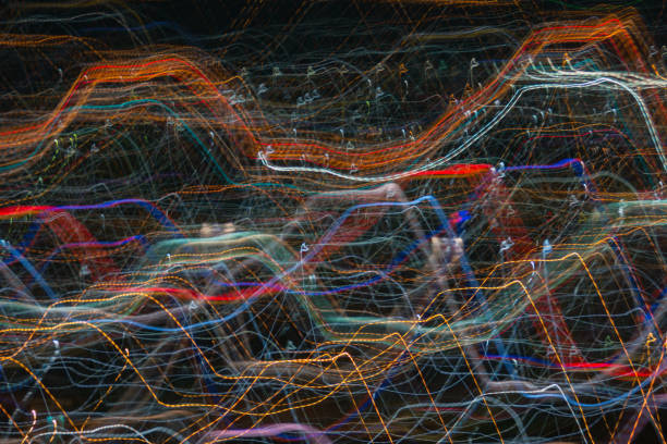 istock light lines with long exposure,  speed motion abstract background in the dark night ,  blast zoom effect , zoom burst of light in the city 880748378