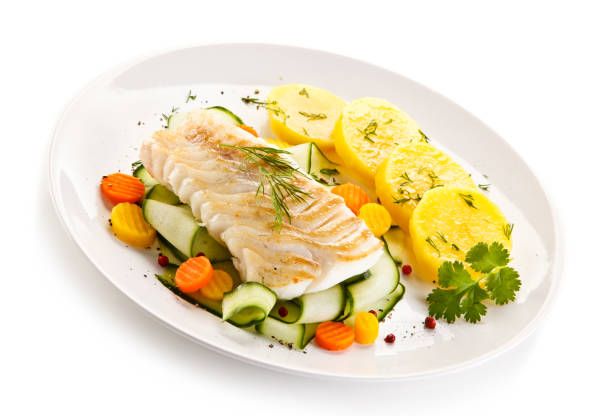 istock Fish dish - fried fish fillet and vegetables 880750582
