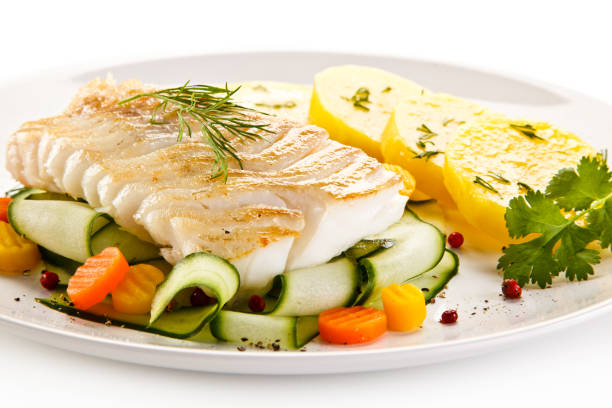 istock Fish dish - fried fish fillet and vegetables 880750630