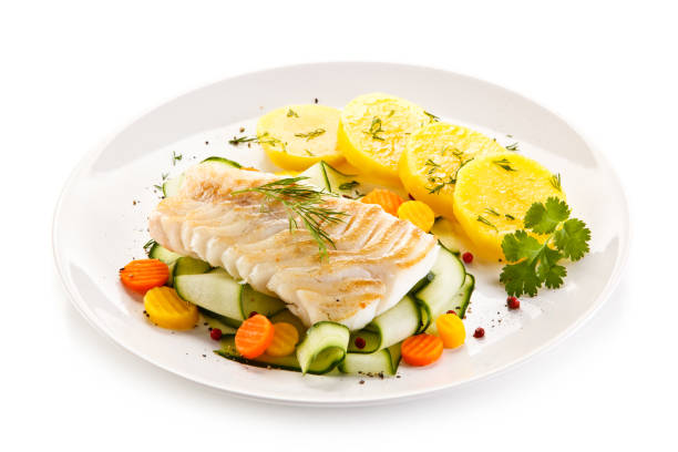 istock Fish dish - fried fish fillet and vegetables 880750648