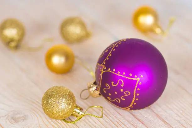 christmas baubles on white wooden table
