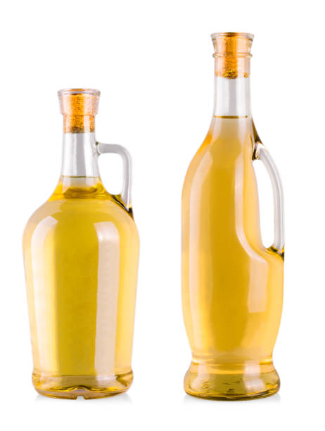 istock bottles with white wine  in a white background. 880753090