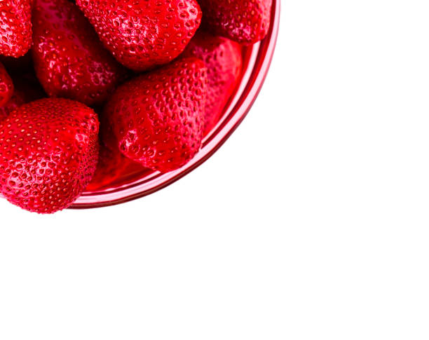 istock strawberries in glass Cup isolated on white background. View from the top 880753230