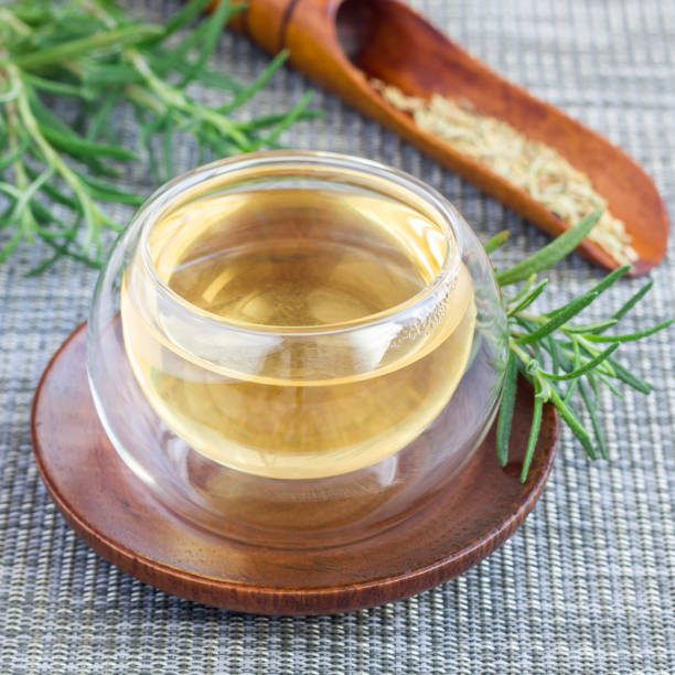 istock Herbal rosemary tea in glass cup on oriental background, square 880755576