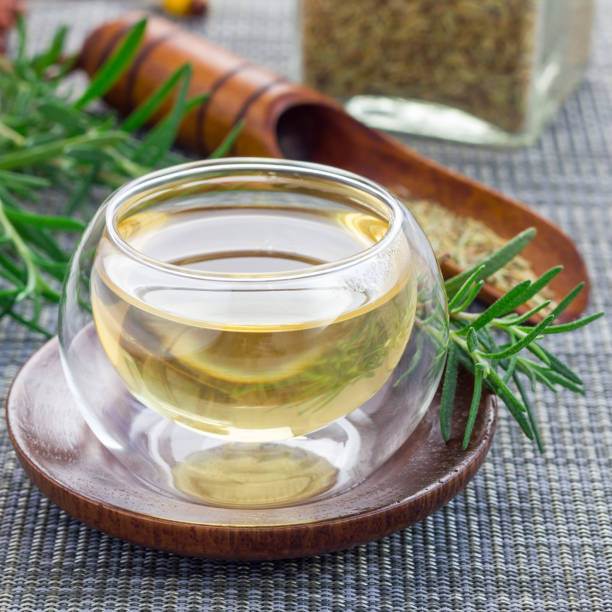 istock Herbal rosemary tea in a glass cup on oriental background, square 880755586