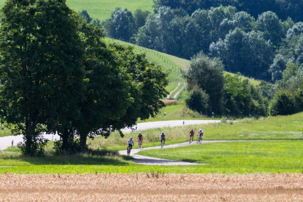 istock cyclists in a distance view on a summer sunny day 880760676