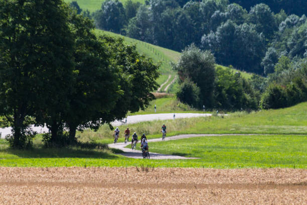 istock cyclists in a distance view on a summer sunny day 880760704