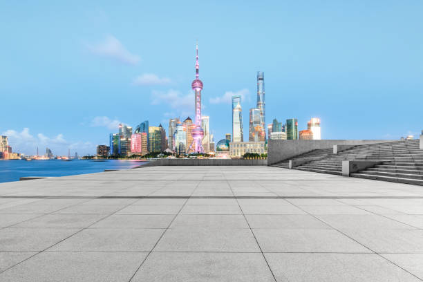 istock Empty square floor and modern cityscape at night in Shanghai 880776744