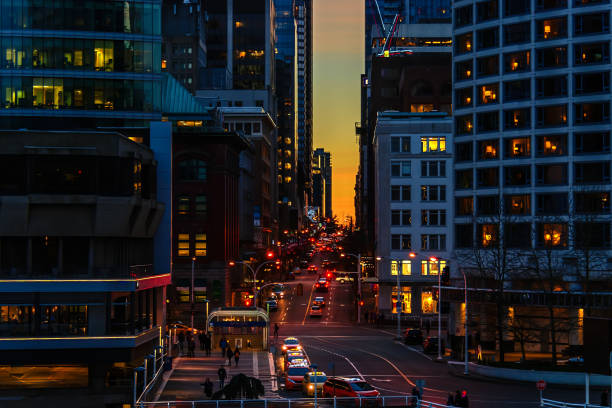 downtown at big megapolis at night with a traffic light, car, buildings and offices, peoples and road in the street