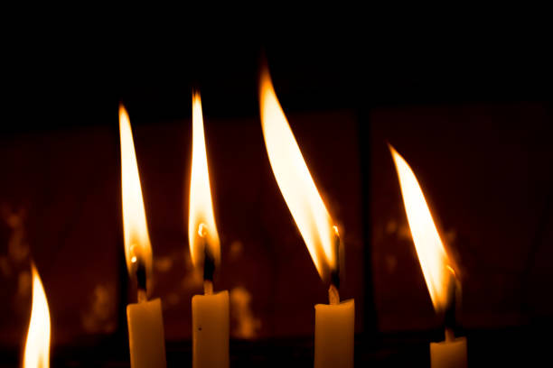 istock Burning candles give light in the dark 880795592