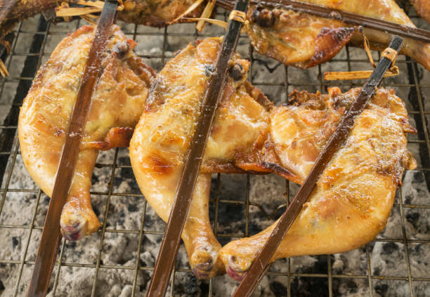 istock Grilled chicken on stove. Roast chicken by using bamboo 880802012
