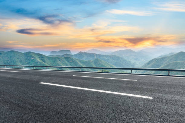istock Asphalt road and mountain nature landscape at sunset 880802130