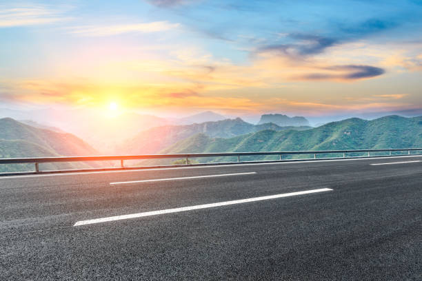 istock Asphalt road and mountain nature landscape at sunset 880804666