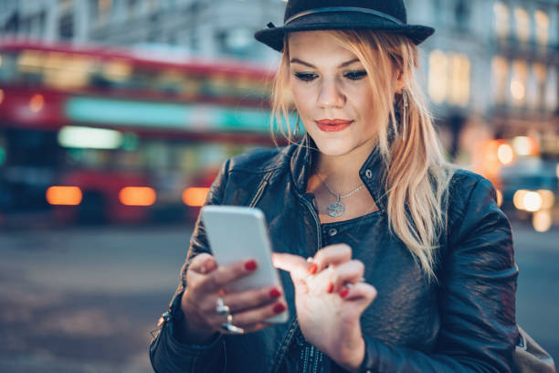 istock Girl texting in London city 880807944