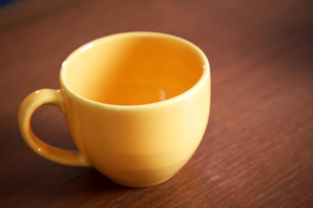 istock Empty yellow cup of coffee 880815386