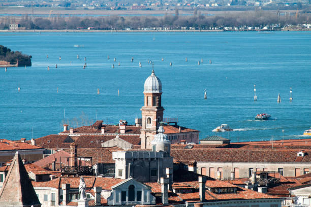 A panoramic aerial view of Venice taken from the tower of San Marco Campanile on a cloudy autumn day.