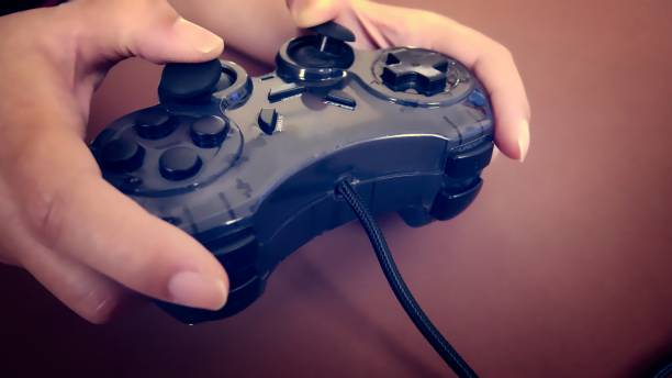 istock Playing Games with Black Joy Stick in Hand 880838746