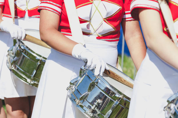 istock Girl in uniform put on brilliant drum sticks 880851250