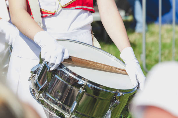 istock Girl in uniform put on brilliant drum sticks 880851276