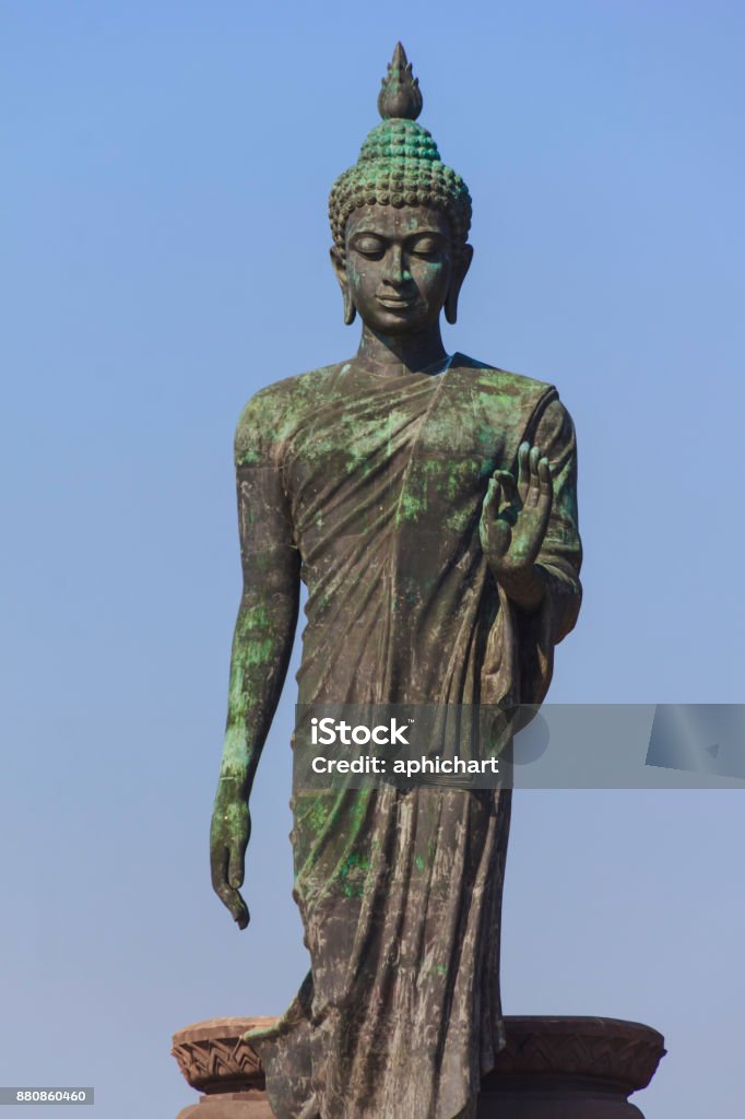 buddha statue stand up buddha statue stand up at outdoor in big park Ancient Stock Photo