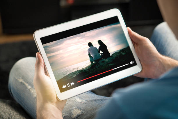istock Online movie stream with mobile device. 880861434