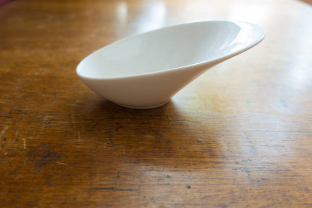 istock Gravy boat on wooden table (side view) 880864350