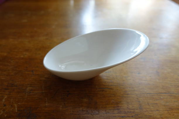 istock Sauce boat on wooden table (white, empty) 880864390